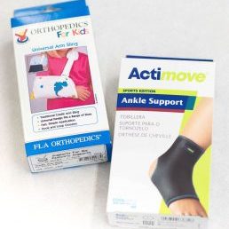 Photograph of an arm sling and an ankle brace